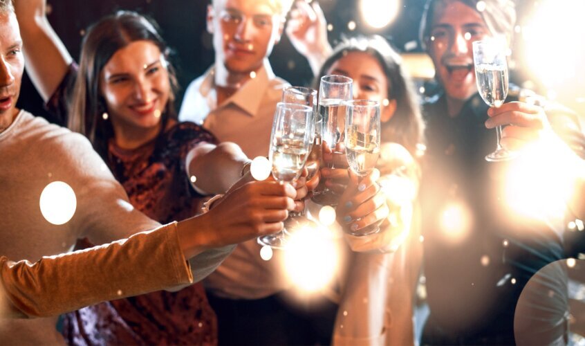 group_cheerful_young_people_have_party_celebrating_new_year_indoors